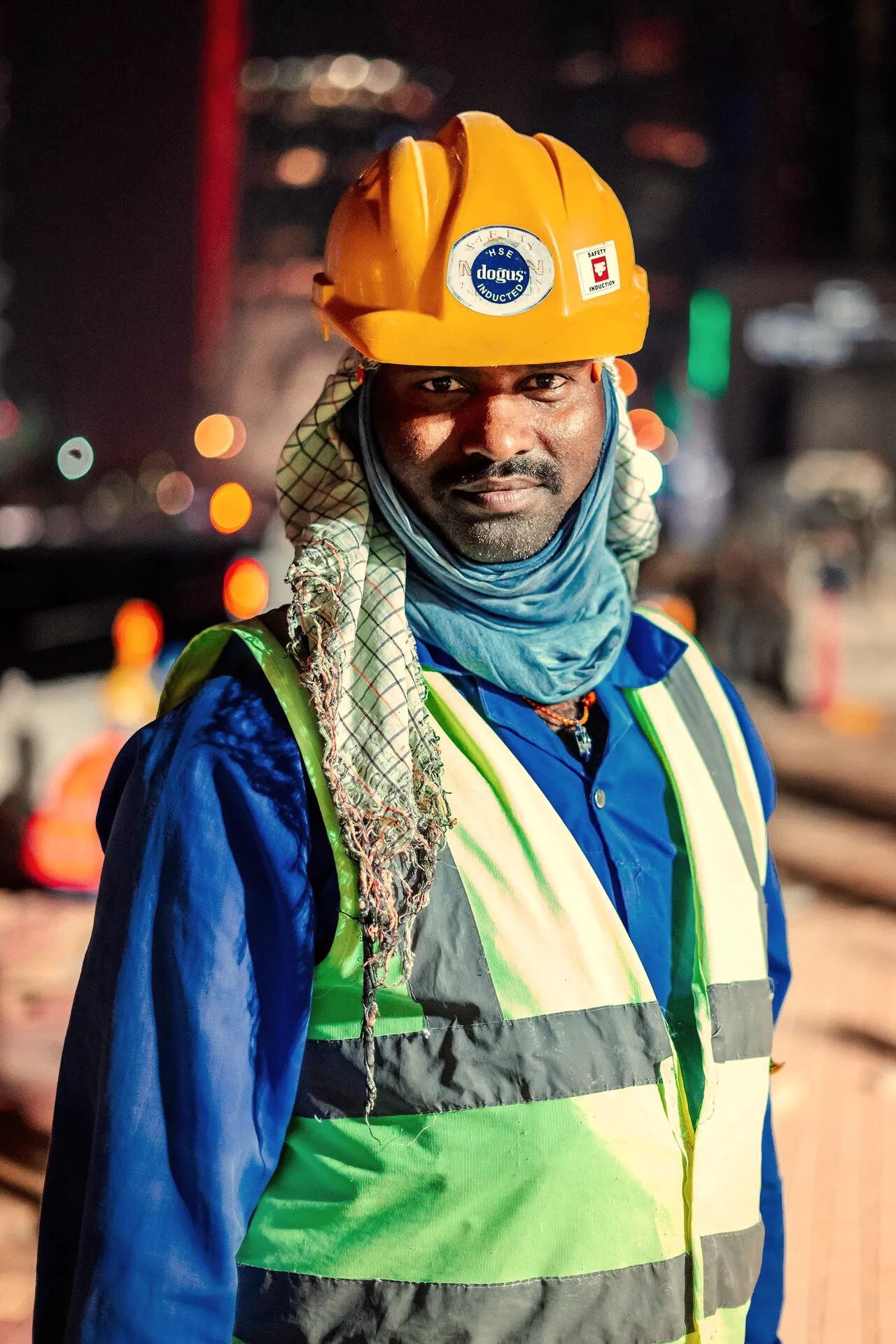 Site crew member in hard hat and high-visibility vest